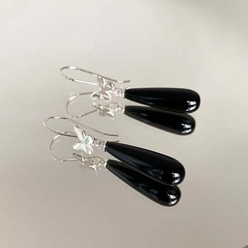 Butterflies glisten with black onyx drops with these stylish earrings by INIZ