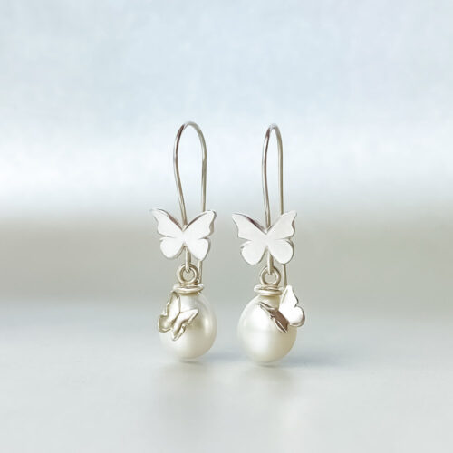 Fly with Me Pearl Earrings has two butterflies on each side. Handcrafted by Christina Lim
